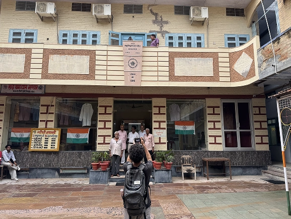 The khadi mandir building in Bikaner, with Indian flags in the windows and staff standing at the entrance